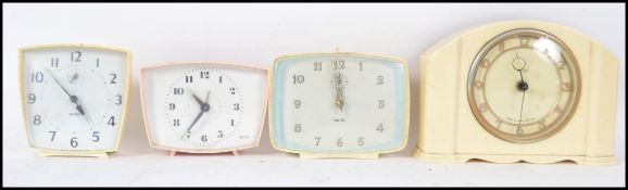 A group of 4 retro 20th century vintage Smiths clock to include a bakelite mantle clock and three