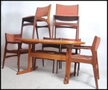 A Danish teak wood dining table having inset tile