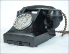 A vintage 20th century bakelite black telephone ha