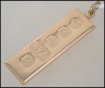A hallmarked 9ct gold ingot pendant. Hallmarked for Sheffield. Maker Carrs of Sheffield 1977. Weight