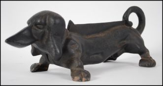 A  20th century cast iron boot scrap in the form o