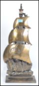 A vintage 20th century heavy brass fireside compendium set in the form of a Viking long boat with
