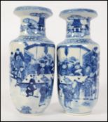 A pair of highly decorated blue and white vases of