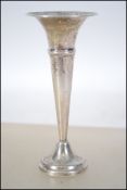 A silver hallmarked small stem vase being hallmark