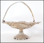 A large silver bon bon dish cast in relief with be