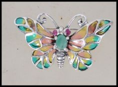 A silver plique a jour brooch in the form of a butterfly