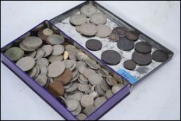 A collection of coins dating from the 18th century to include a George I coin dating to 1722