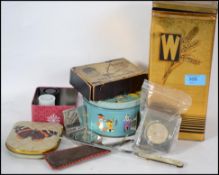 A collection of items to include a vintage Weetabix tin, collectors tin, sweet ti, selfridges razor,