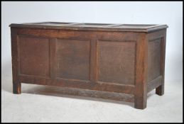 An early 20th century country oak coffer with stil