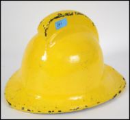 A 20th century solid cork fireman's helmet.  This