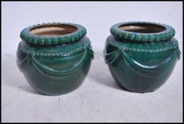 A large pair of majolica turquoise glazed planters