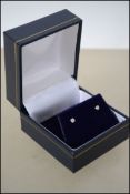 A pair of 14ct white gold diamond stud earrings.