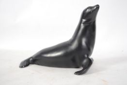 A Royal Dux figure of a seal with pink triangle br