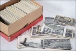 REAL PHOTO postcards. All small size black & white British views.Mixed age.Large range in shoebox