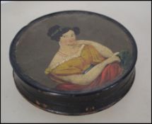 A 19th century papier mache patch box being ebonis