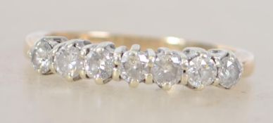 A 9ct gold 375 hallmarked 7 stone diamond ring approx 70pnts total. Size M.5 / Total weight2.2g