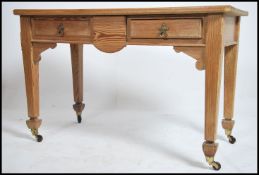 A Victorian pitch pine Arts & Crafts writing table