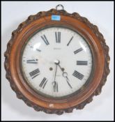 A Victorian French Oak cased Station wall clock with enamel painted dial with roman numeral