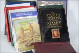 A collection of stamps in various albums to include British, Commonwealth and colonies. To also