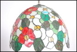 A very large Tiffany style leaded and coloured gla