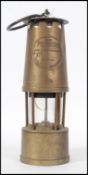 A brass vintage 20th century miners lamp with nota