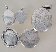 A collection of 5 silver lockets to include oval rococo chase, rococo chase circular, heart shaped