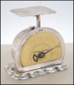 A set of Edwardian silver postage scales, by Levi