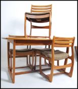 A 1970's retro Portwood furniture teak dining tabl