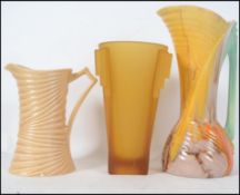 A collection of Art Deco ceramic vases in ceramic and glass to include a tall drip glaze jug,