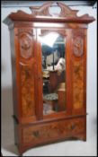 An Edwardian walnut double wardrobe armoire. Raise