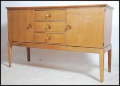 An original Gordon Russell walnut sideboard / dres