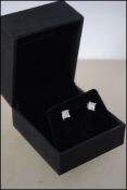 A pair of 925 silver and CZ cushion cut stud earri