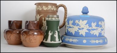 A Wedwood Jasperware cameo cheese dish and cover in blue and white together with a similar silver