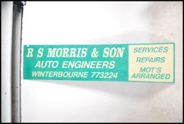 A retro 20th century two tone Garage sign with not