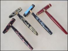 A collection of three vintage 20th century fountain / ink pens to include a Swan self filler