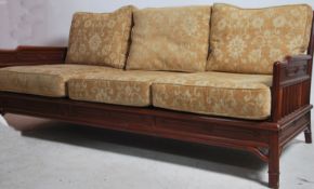 A 20th century Chinese influenced sofa, having an