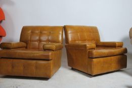 A pair of stunning retro 1960's Danish armchairs. Having a vinyl button back upholstery in