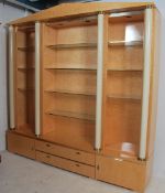 A stunning Biedermeier style birds eye maple and cream sideboard display cabinet. Raised on long
