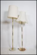 2 vintage mid century onyx and gilt metal standard lamps, both raised on terraced bases with shades