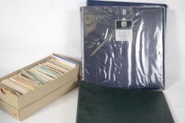 A collection of 4 modern postcard albums of mainly topographical scenes together with a shoebox of