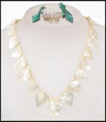 A stunning pair of 1920s Art Deco silver and malachite drop earrings along with a 1950s mother of