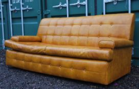A stunning retro 1960's Danish three seater sofa. Having a vinyl button back upholstery in