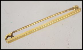 A 9ct gold gentlemens tie clip with safety catch complete in original retailers box. Weighs 0.9