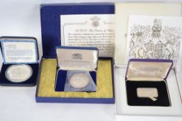 A group of three silver proof coins to include the