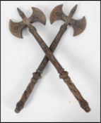 A pair of unusual cast iron medieval style hand ax