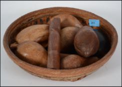 A group of unusual carved wooden fruits held withi