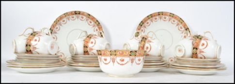 A Royal Albert Crown China part tea service dating to the early 20th century comprising cups,