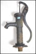 A good early 20th century cast iron water pump complete with shaped handle to the cylindrical