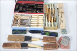 A collection of vintage items to include cased flatware, three cased cut throat razors etc.