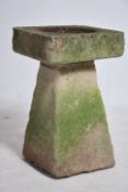 Garden Ornament. A well weathered 20th century reconstituted stone bird bath, the bowl supported